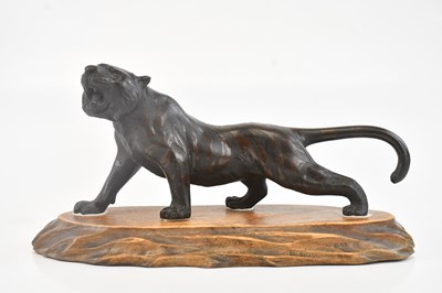 Lot 1082 - A Japanese hollow cast bronze model of a tiger,...