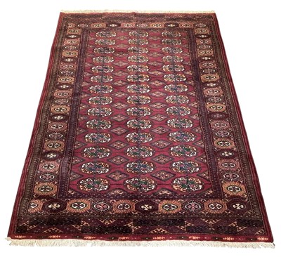Lot 123 - A hand woven red ground Tekke Turkmen rug,...