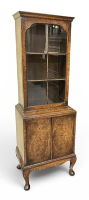 Lot 87 - A 1930s burr walnut bookcase of narrow...