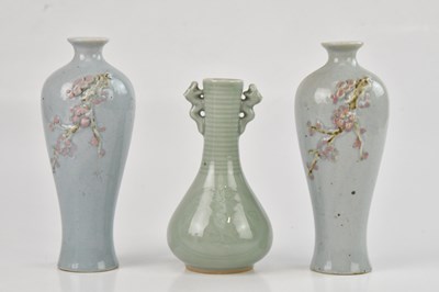 Lot 1014 - A Chinese celadon glazed pear shaped vase,...
