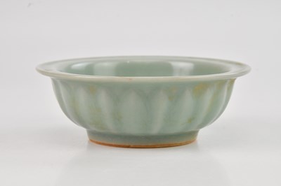 Lot 1099 - A Chinese Longquan celadon footed bowl, relief...