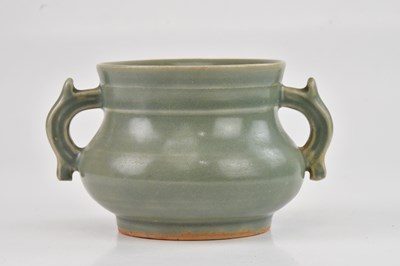 Lot 1035 - A Chinese celadon glazed twin handled incense...