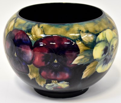 Lot 260 - MOORCROFT; a Pansy pattern jardinière, with...