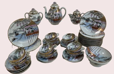 Lot 318 - A Japanese porcelain teaset featuring a...