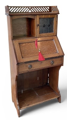 Lot 77 - An early 20th century Arts and Crafts oak...