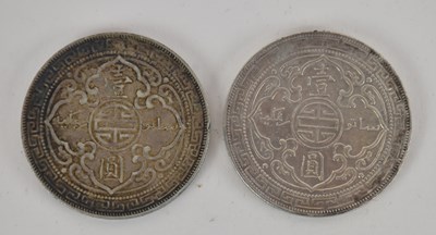 Lot 1619 - Two silver British Far East trade dollars,...