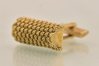 Lot 1465 - A yellow metal textured cufflink with woven...