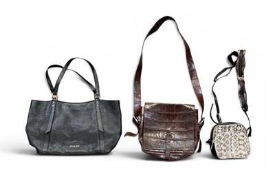 Lot 564 - MICHAEL KORS; a lady's black leather handbag,...