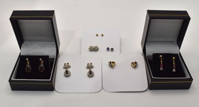 Lot 672 - Three pairs of yellow metal earrings, together...