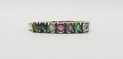 Lot 663 - A 9ct yellow gold 'dearest' seven stone ring,...