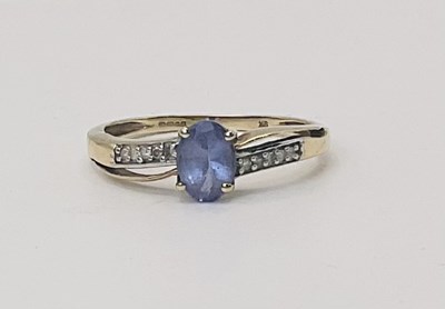 Lot 669 - A 9ct yellow gold tanzanite and diamond dress...