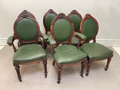Lot 148 - A set of six carved walnut and green...