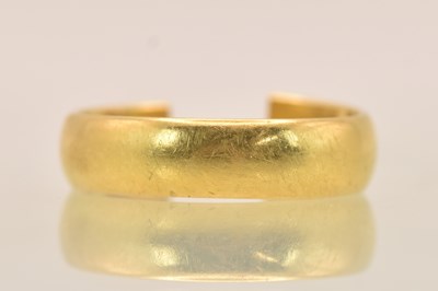 Lot 1245 - A 22ct yellow gold band ring with D shaped...
