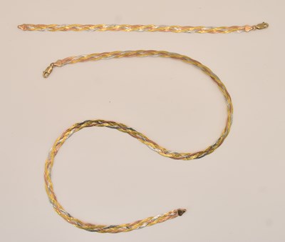 Lot 1386 - A 9ct tricolour gold woven semi-rigid necklace,...