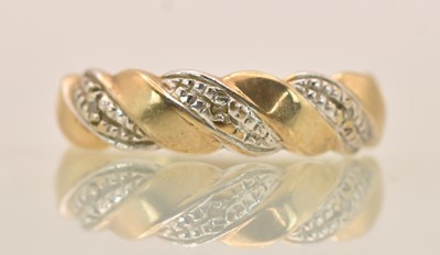 Lot 1353 - A 9ct silver and white coloured gold ring,...