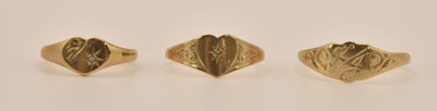 Lot 1354 - Three 9ct yellow gold small sized rings, the...