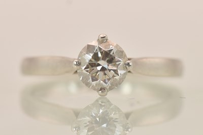 Lot 1246 - A platinum (950) diamond solitaire ring, the...