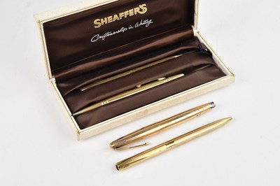 Lot 2248 - SHEAFFER; a cased rolled gold three piece...