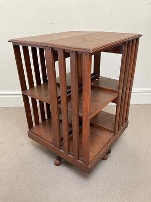 Lot 2040 - A late 19th century oak revolving bookcase,...