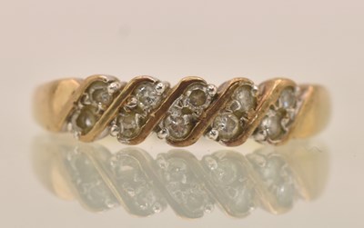 Lot 1343 - A 9ct yellow gold white stone set ring, size K,...