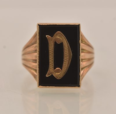Lot 1306 - A 9ct yellow gold onyx set signet ring,...