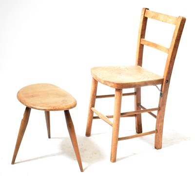 Lot 180 - An Ercol pebble occasional table, and an...