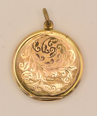 Lot 1388 - A gold coloured yellow metal circular locket,...