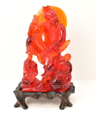 Lot 1051 - A large modern Chinese red jade style resin...