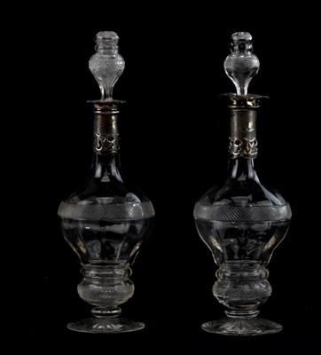 Lot 1438 - A pair of cut glass decanters, with hollow...