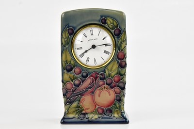 Lot 1403 - SALLY TUFFIN FOR MOORCROFT; a mantel clock in...
