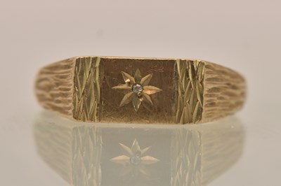 Lot 1338 - A 9ct yellow gold diamond set signet ring,...