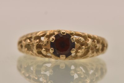 Lot 1339 - A 9ct yellow gold garnet set solitaire ring,...