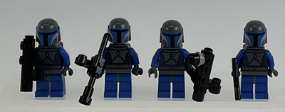 Lot 610 - LEGO; four Lego Star Wars Mandolorian figures,...