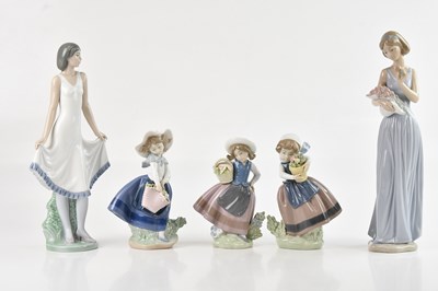 Lot 1219 - LLADRÓ; three ceramic figures, each of girls...