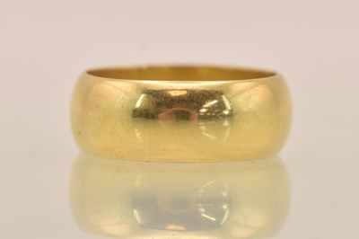 Lot 1242 - An 18ct yellow gold band ring, size Q, approx...