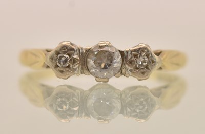 Lot 1300 - An 18ct yellow gold diamond three stone ring,...