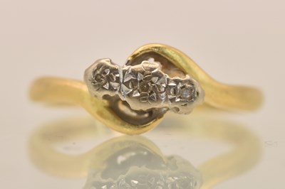 Lot 1301 - An 18ct yellow gold diamond three stone...