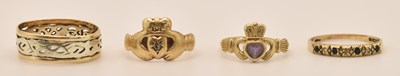 Lot 1278 - Four 9ct yellow gold dress rings comprising a...
