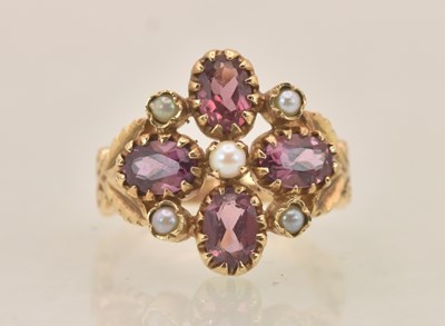 Lot 1349 - A 9ct yellow gold dress ring, with floral top...