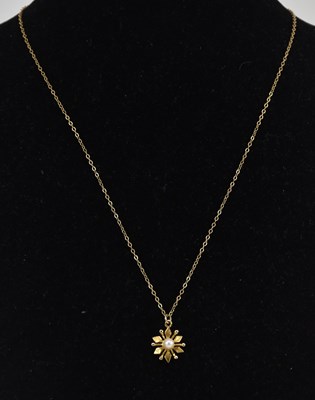 Lot 1433 - A 9ct yellow gold star shaped pendant with...
