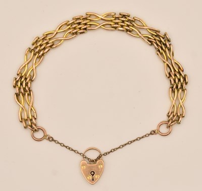 Lot 1502 - A 9ct yellow gold gate link bracelet with...
