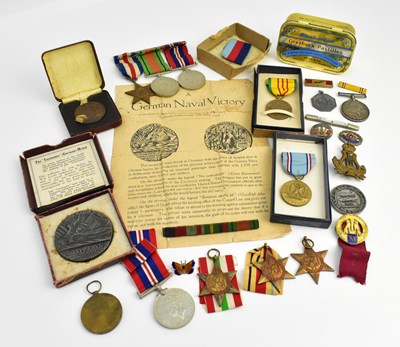 Lot 625 - A group of medals and military related items...