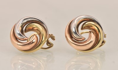 Lot 1446 - A pair of 9ct three colour gold circular swirl...
