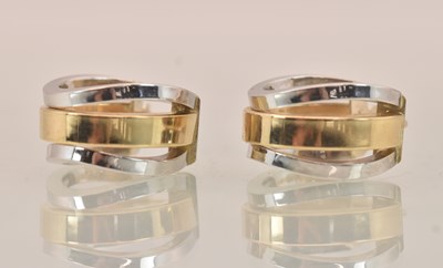 Lot 1453 - A pair of two-tone 9ct gold earrings, the...