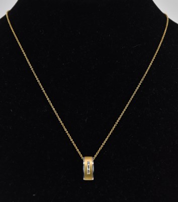 Lot 1384 - An 18ct two-tone gold contemporary pendant...