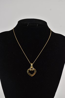 Lot 1369 - A large 18ct yellow gold open heart pendant,...