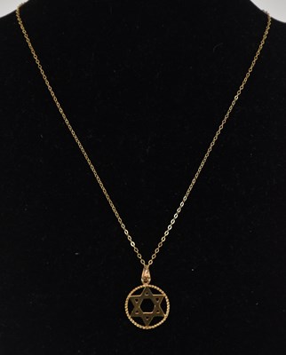 Lot 1421 - A 9ct gold Star of David pendant, diameter...