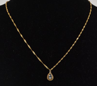 Lot 1430 - A pear shaped cut aquamarine in a 9ct pendant...