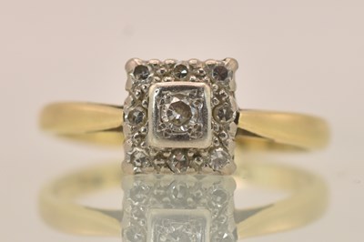 Lot 1318 - An 18ct yellow gold and platinum diamond ring,...