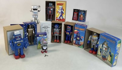 Lot 181 - A group of modern tinplate and plastic robots,...